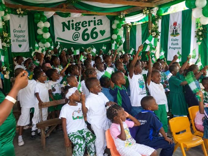 Pupils cheering at the Nigeria @ 66 celebration